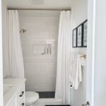airbnb bathroom ideas with subway tile and gold accents