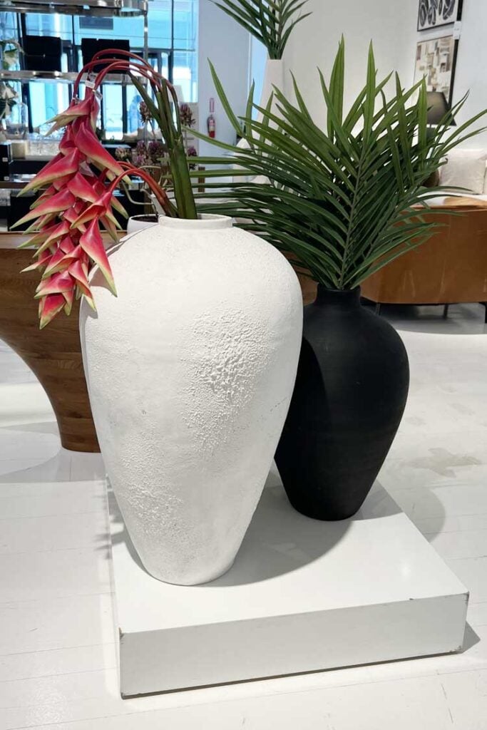 white and black vase with greenery home decor trends 2025