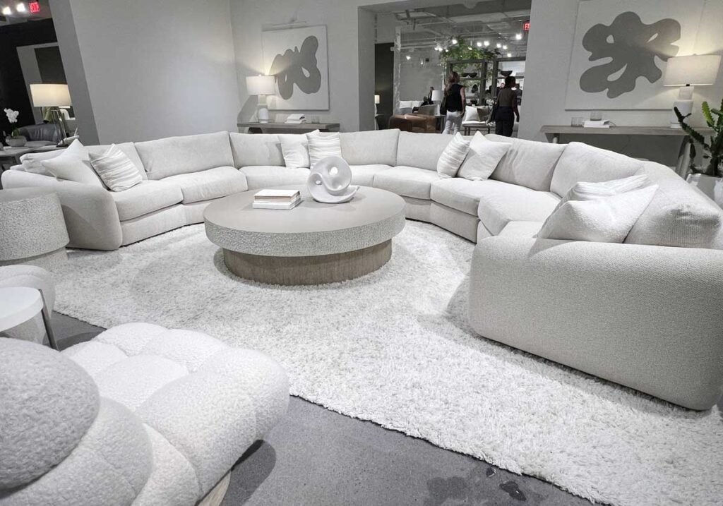 curved white sectional sofa living room quiet luxury interior design