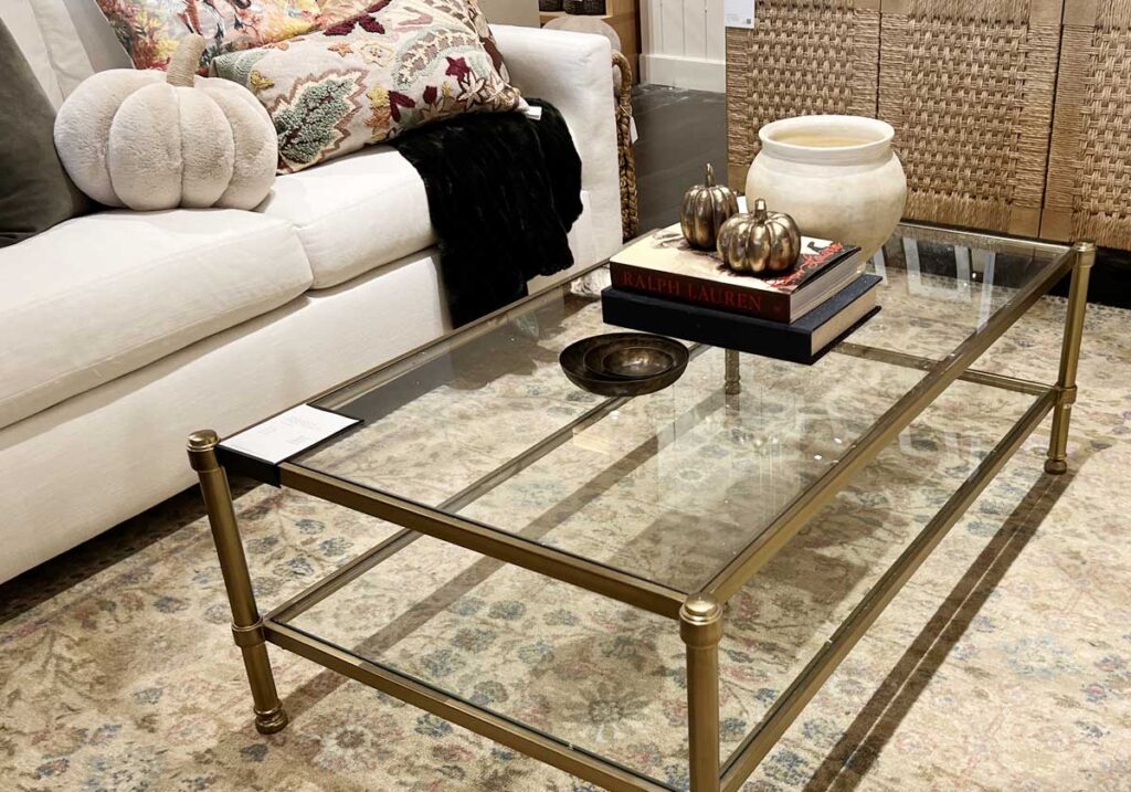 gold and fur pillow pumpkin decor glass table