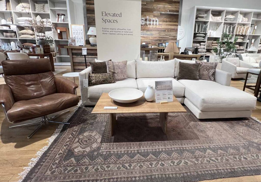 ivory sofa with brown pillows