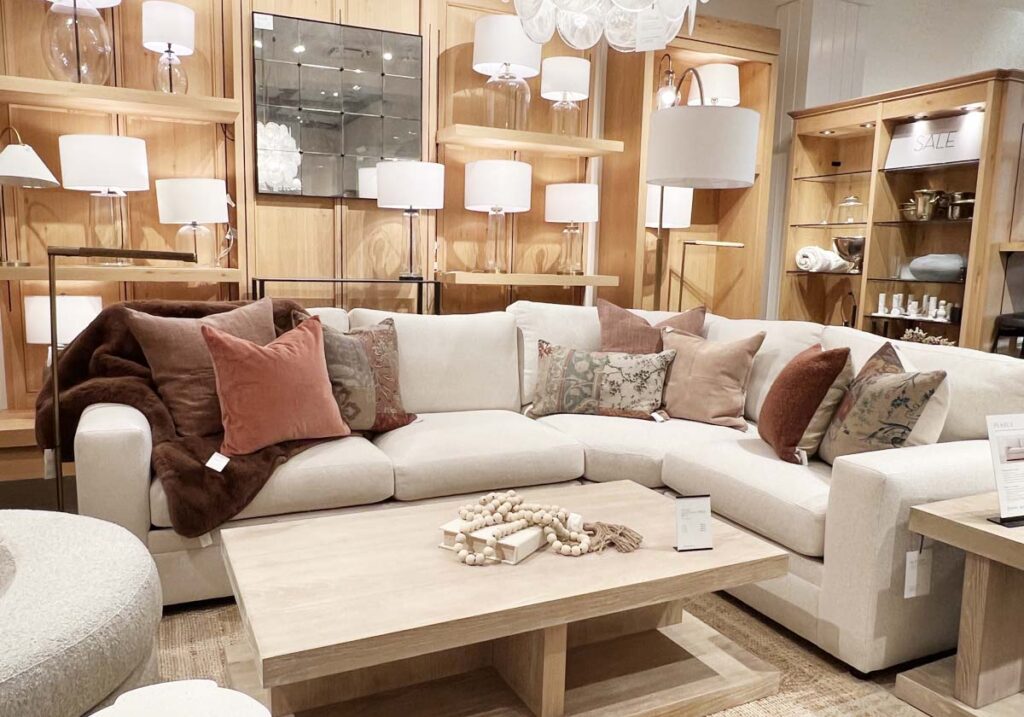 ivory sofa with rust pillows