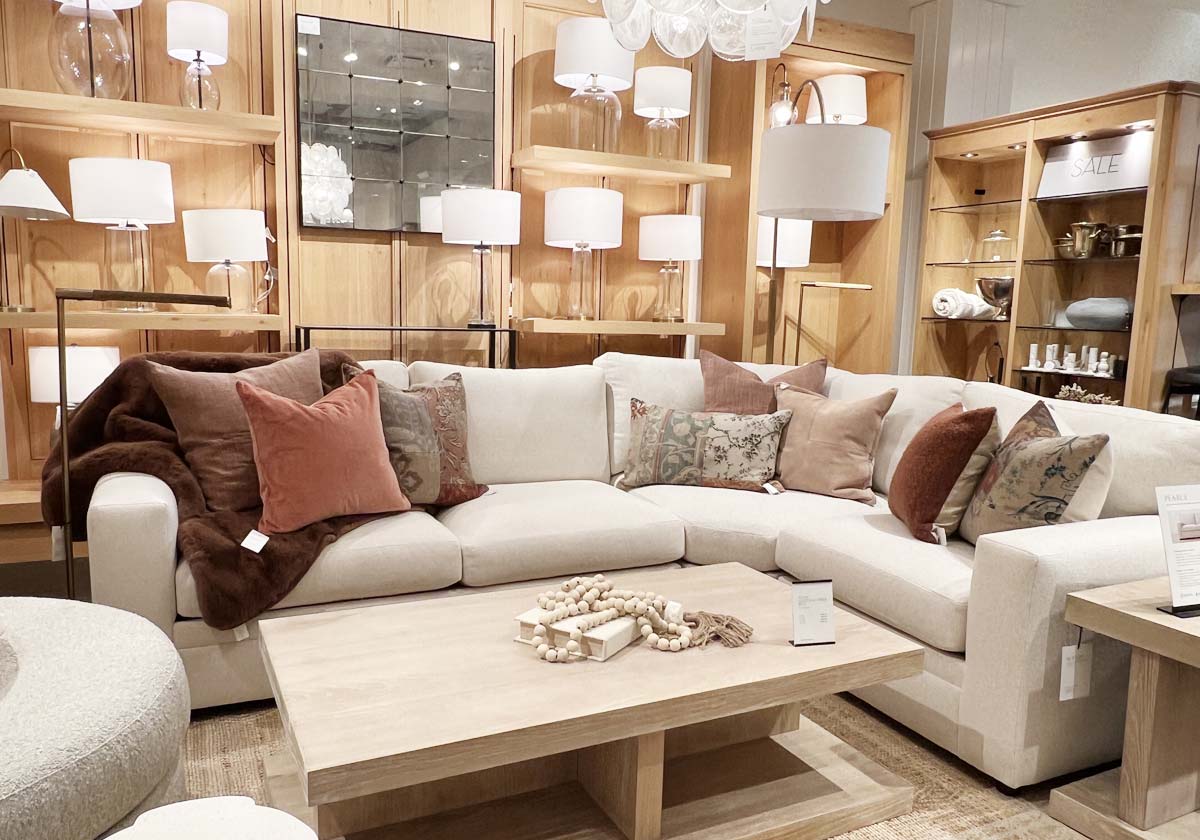 ivory sofa with rust pillows