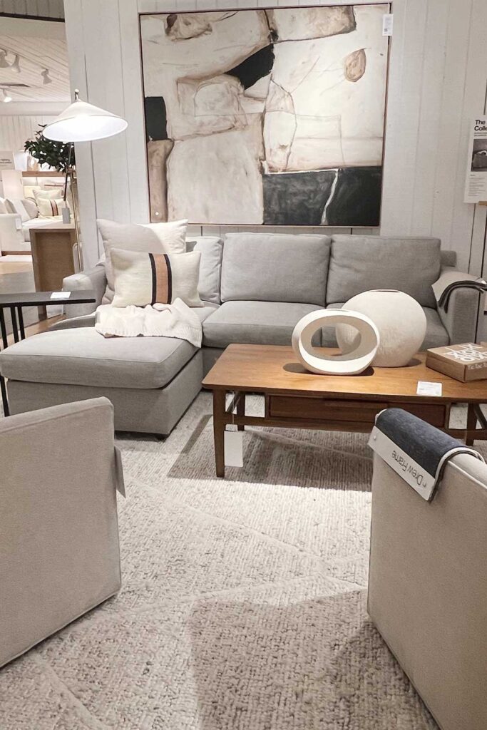 small grey sectional with oversized art