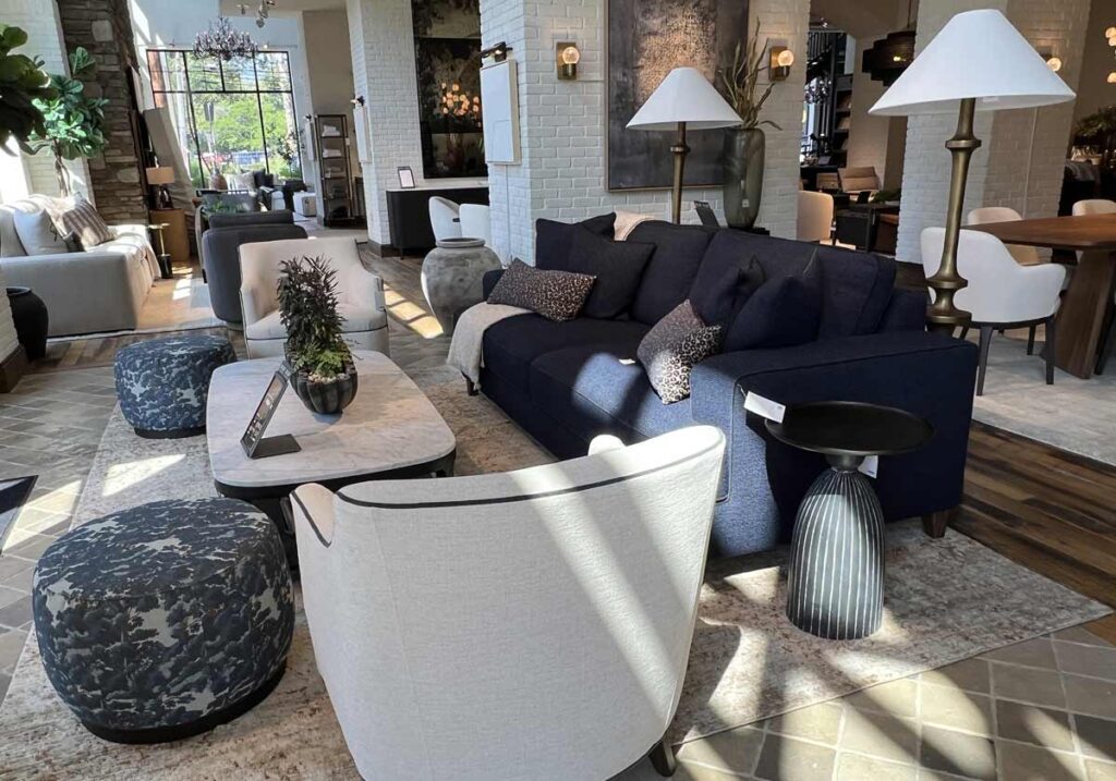 gold floor lamps behind ivory sofa