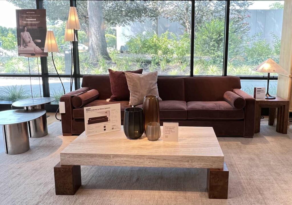 maroon sofa with travertine coffee table