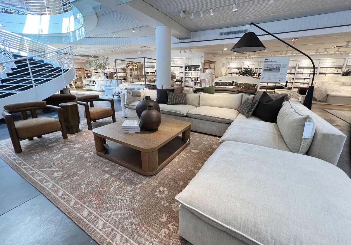 neutral sofa with velvet accent chairs