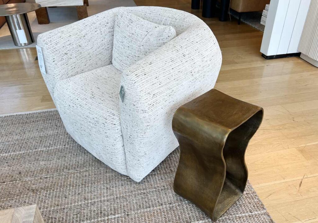 swivel chair with gold sculptural table