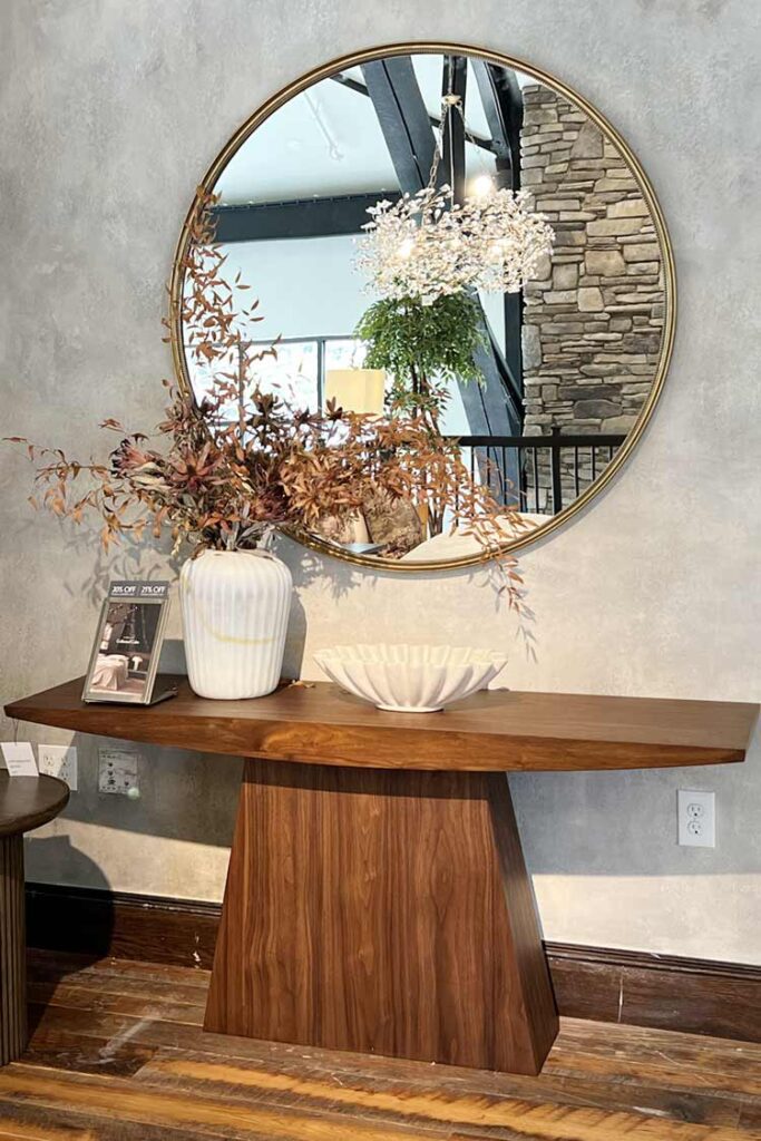 wood console table with round mirror